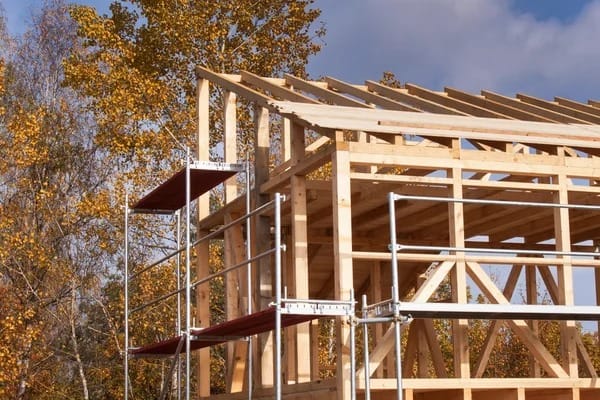 depositphotos_128474542-stock-photo-metal-scaffolding-around-the-unfinished.jpg